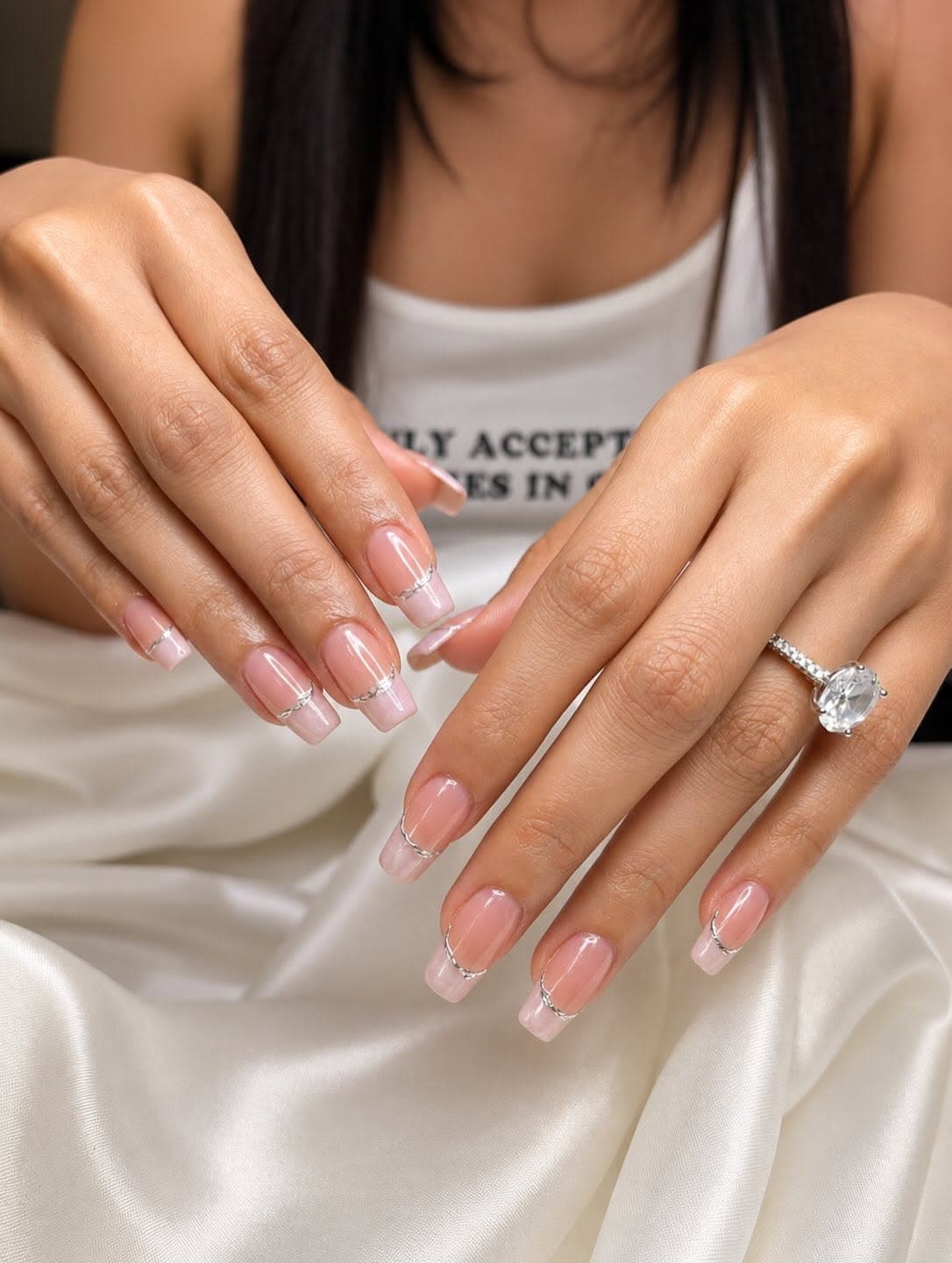 Pink French nails with silver accents